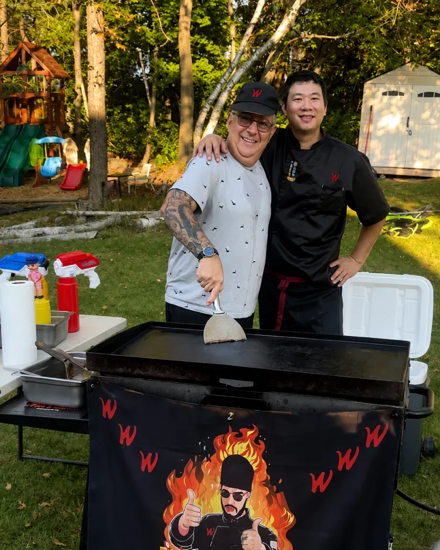 Private hibachi chef with a guest at a backyard hibachi at home experience in Cherry Hill, NJ