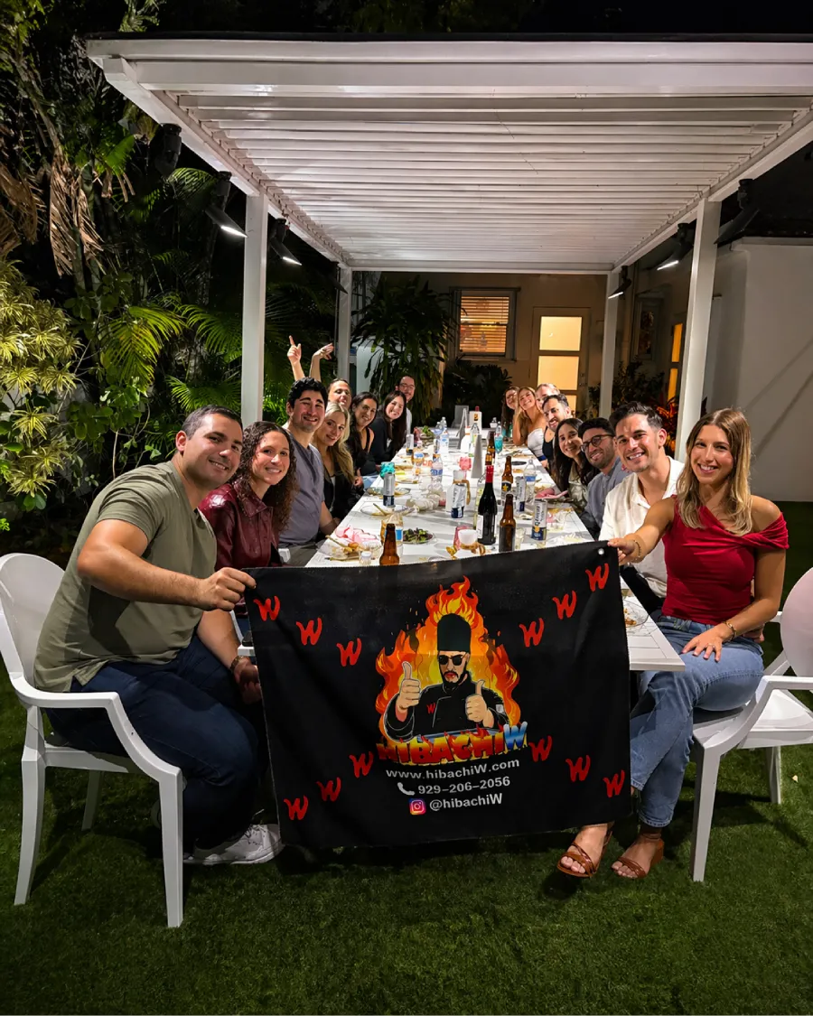 Guests enjoying a backyard hibachi at home dinner in Cherry Hill, NJ