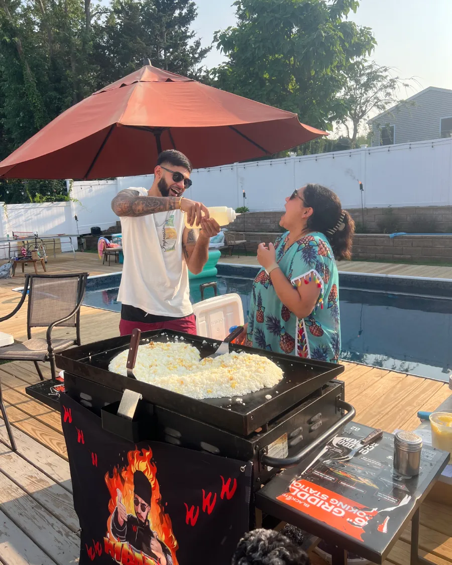 Guests enjoying an interactive poolside hibachi at home experience in Washington DC