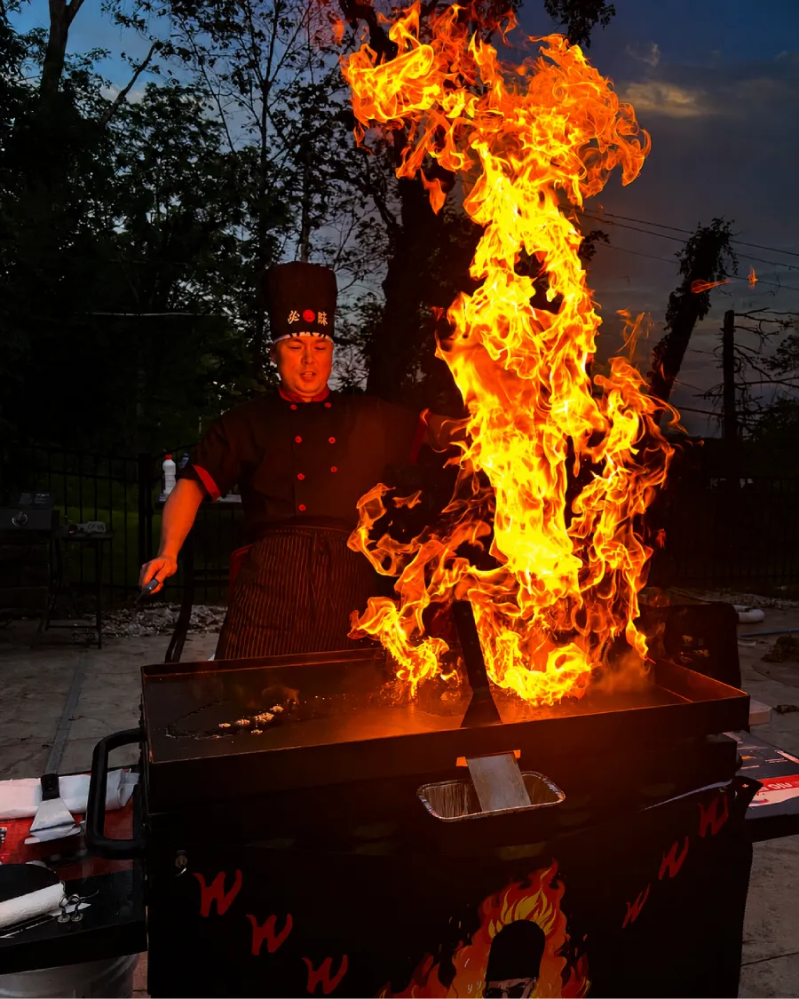 Private hibachi chef performing a live fire show at a hibachi at home experience in Edison, NJ