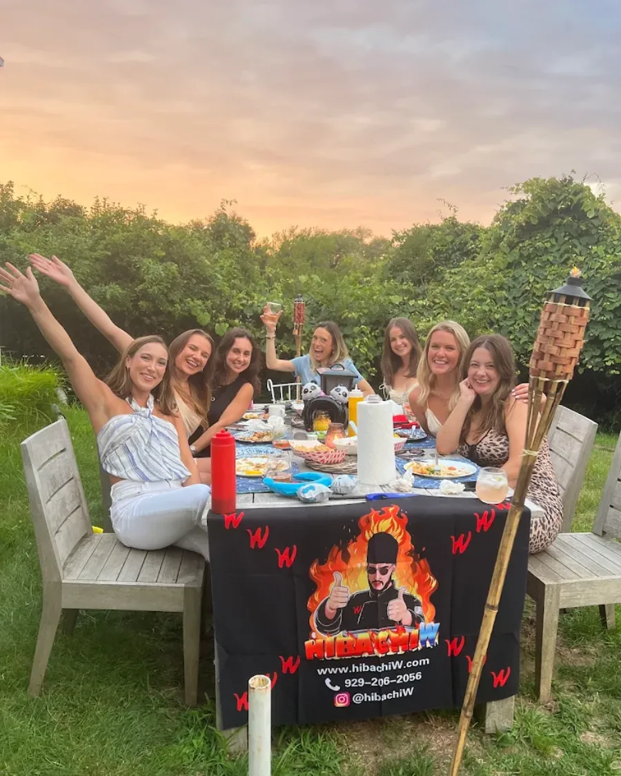 Guests enjoying backyard hibachi at home across Delaware