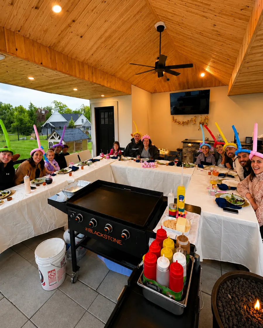 Guests enjoying hibachi at home dining on a covered patio across Delaware