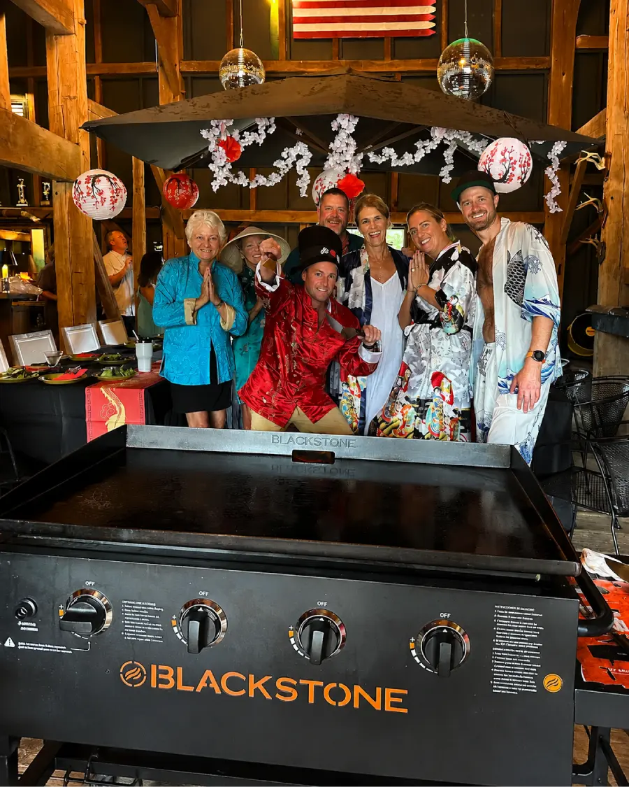 Guests enjoying hibachi at home at a mountain cabin across Poconos