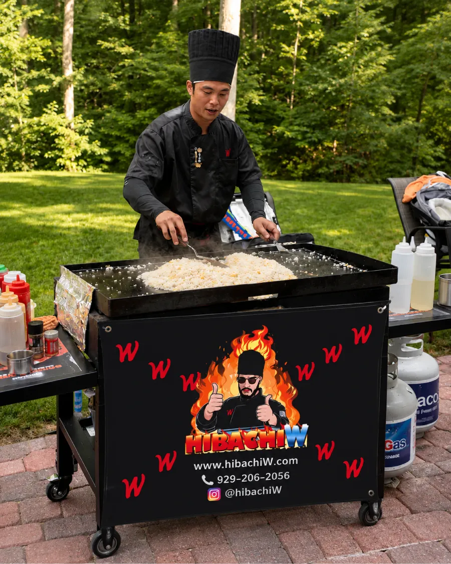 Private hibachi chef cooking outdoors at a wooded property across Poconos