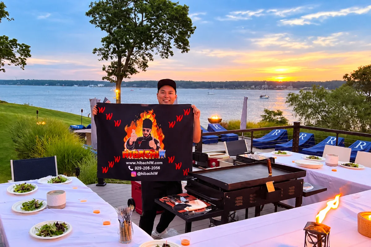 Private hibachi chef with a mobile cooking station and outdoor dining setup