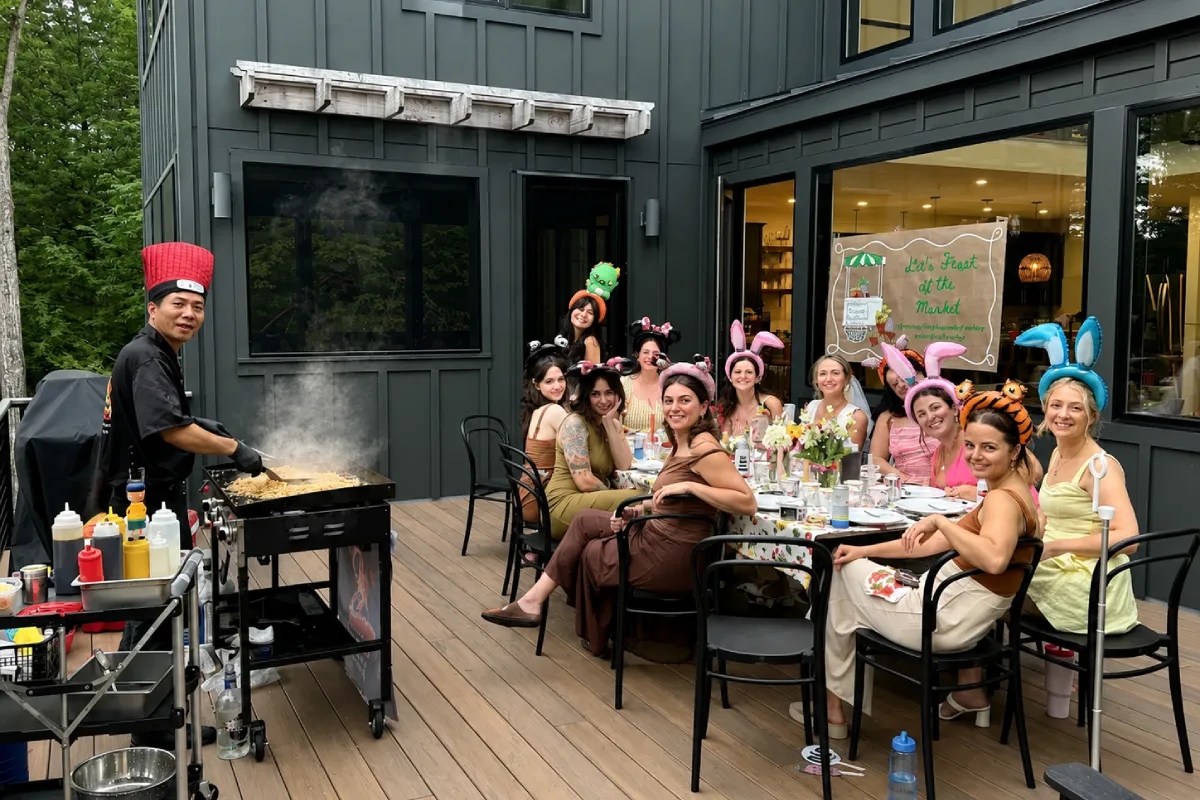 Private hibachi chef cooking fresh food for guests during an outdoor backyard hibachi party