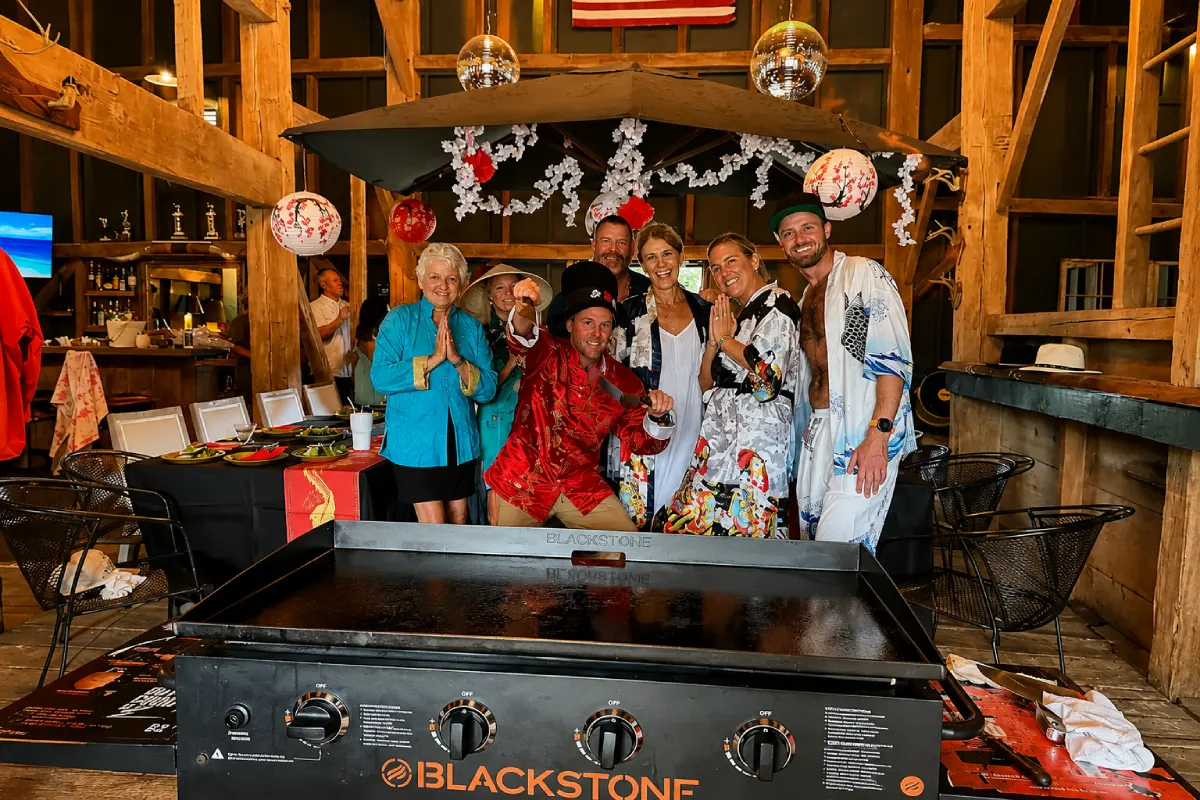 Guests celebrating a themed hibachi party with Japanese decorations and a private group dining setup