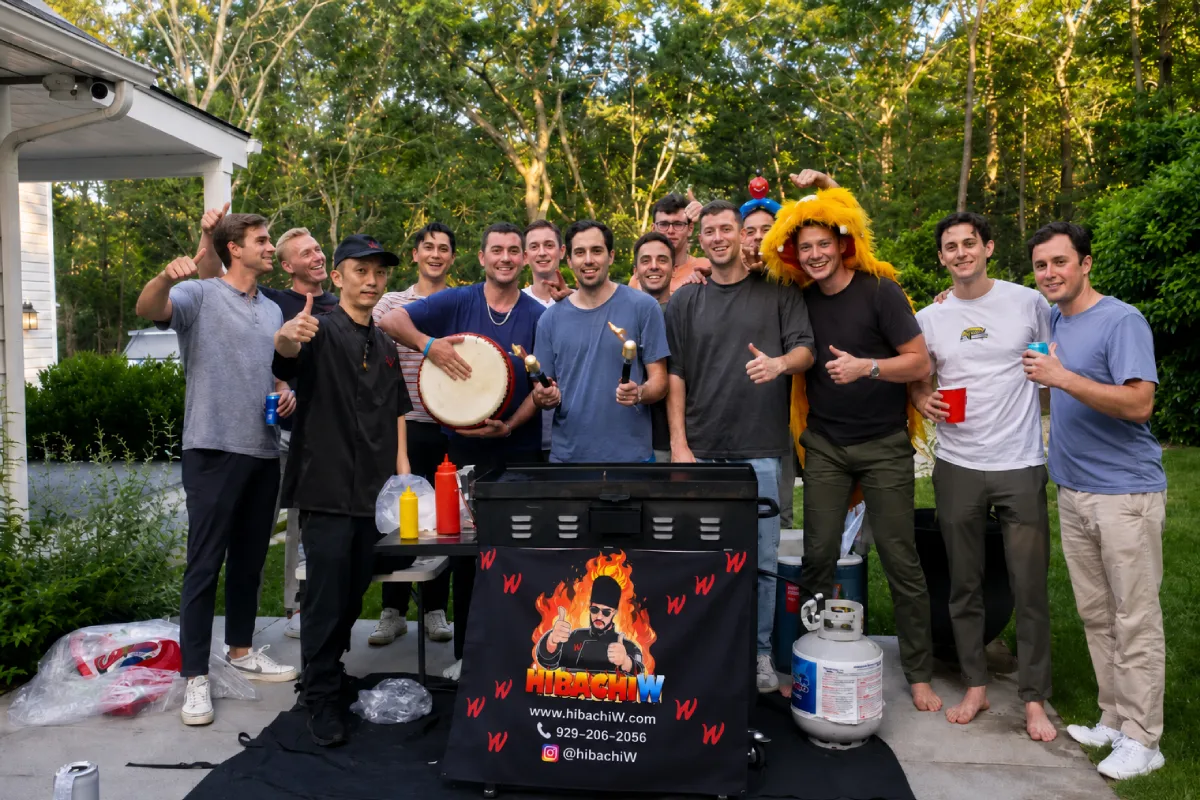 Friends celebrating a backyard hibachi graduation party with a private chef