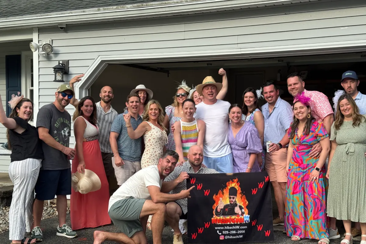 Backyard hibachi party in Florida with a private hibachi chef and guests celebrating together